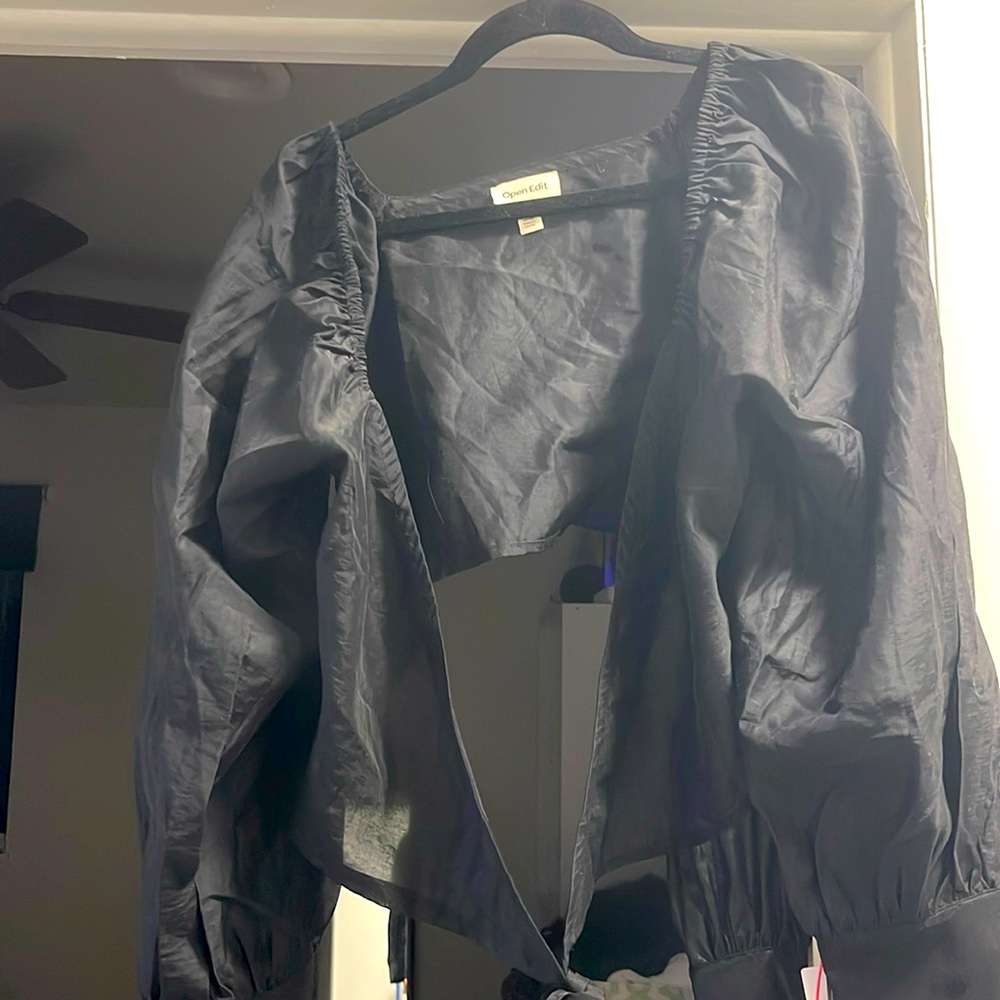 NWT. Black long sleeve wrap tie cropped blouse.